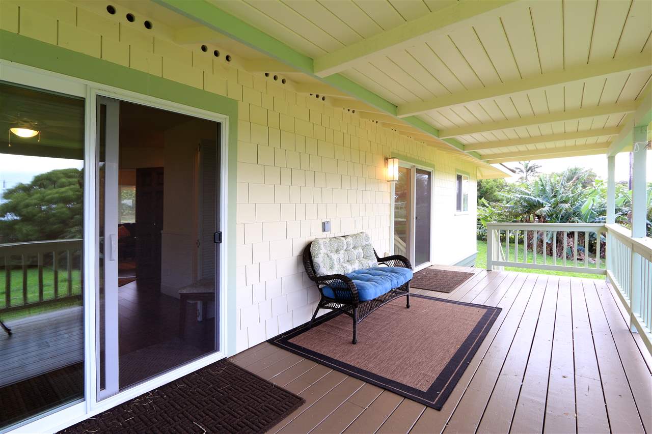 1855 B Kauhikoa Road Haiku, HI 96708 - Photo 10 of 30 a view of a balcony with furniture and wooden floor