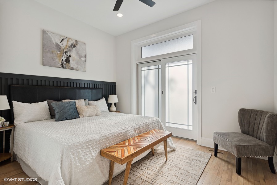 2139 West Crystal Street, Unit 1 Chicago, IL 60622 - Photo 13 of 27 a bedroom with a bed and a couch