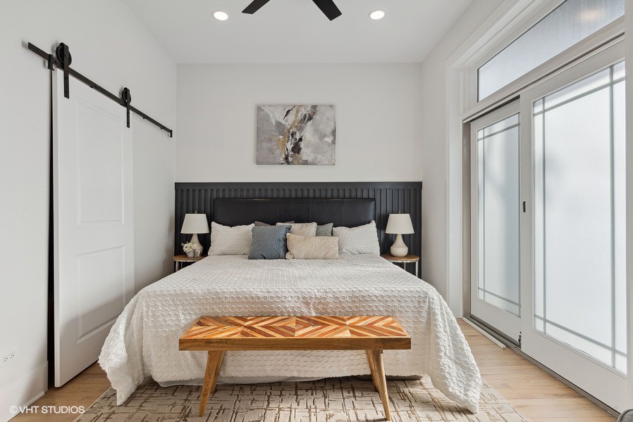 2139 West Crystal Street, Unit 1 Chicago, IL 60622 - Photo 14 of 27 a bedroom with a bed and a painting on the wall