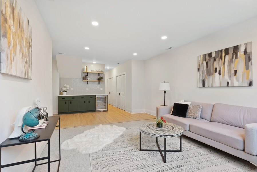 2139 West Crystal Street, Unit 1 Chicago, IL 60622 - Photo 17 of 27 a living room with furniture and a rug