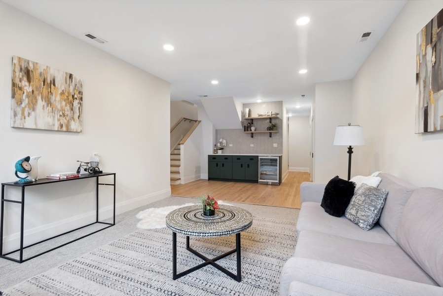 2139 West Crystal Street, Unit 1 Chicago, IL 60622 - Photo 18 of 27 a living room with furniture and a fireplace