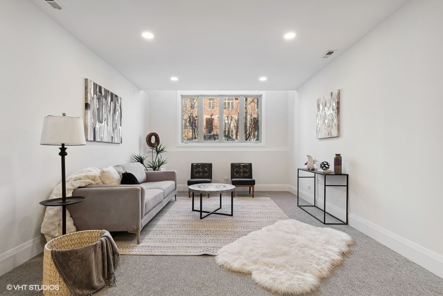 2139 West Crystal Street, Unit 1 Chicago, IL 60622 - Photo 19 of 27 a living room with furniture and a window