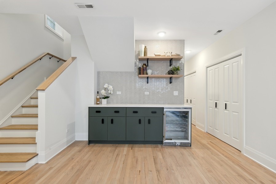 2139 West Crystal Street, Unit 1 Chicago, IL 60622 - Photo 21 of 27 a view of kitchen with wooden floor electronic appliances and stairs
