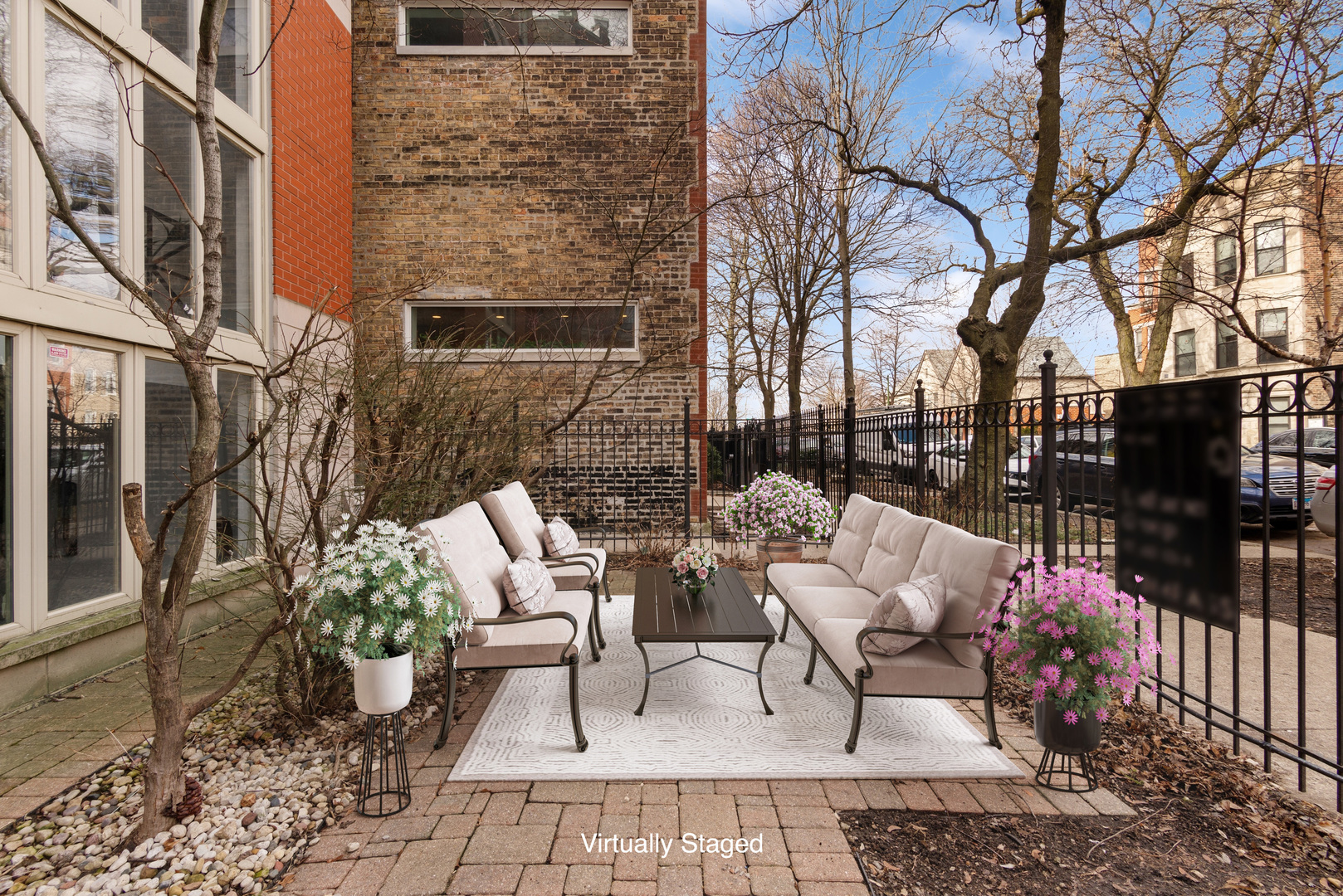 2139 West Crystal Street, Unit 1 Chicago, IL 60622 - Photo 26 of 27 a view of a patio with couches table and chairs and potted plants