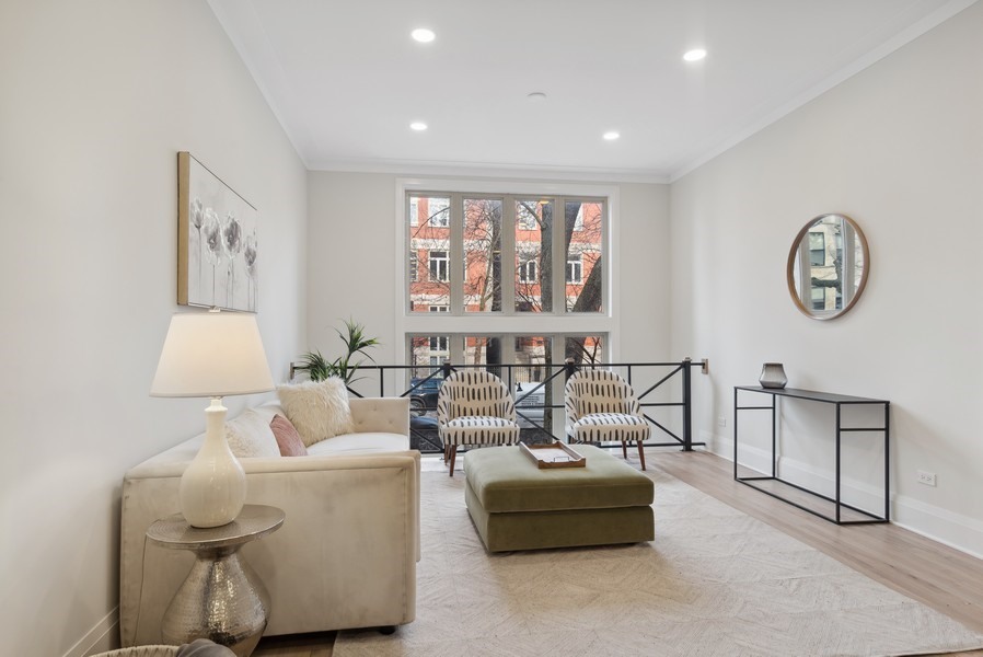 2139 West Crystal Street, Unit 1 Chicago, IL 60622 - Photo 3 of 27 a living room with furniture and a large window