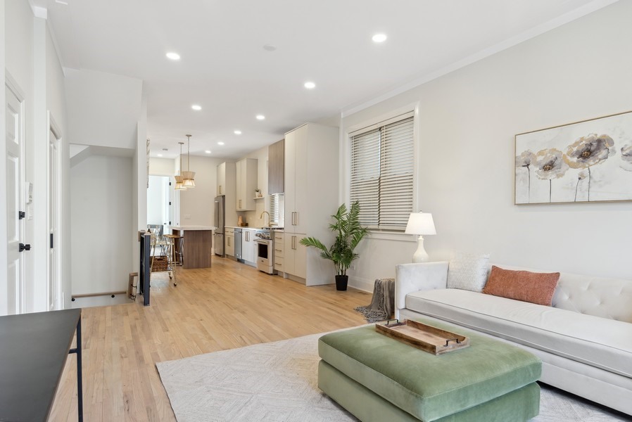 2139 West Crystal Street, Unit 1 Chicago, IL 60622 - Photo 4 of 27 a living room with furniture and a table