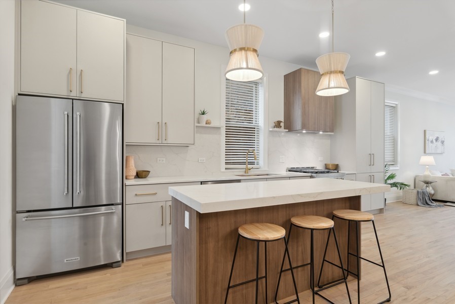 2139 West Crystal Street, Unit 1 Chicago, IL 60622 - Photo 8 of 27 a kitchen with refrigerator a sink and wooden floor