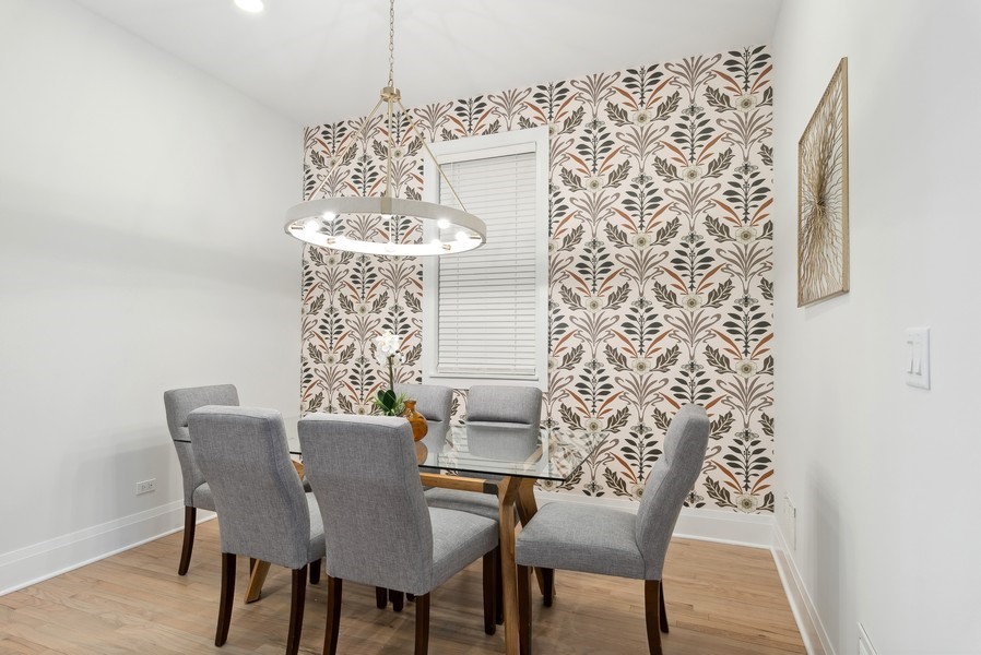 2139 West Crystal Street, Unit 1 Chicago, IL 60622 - Photo 9 of 27 a view of a dining room with furniture and chandelier