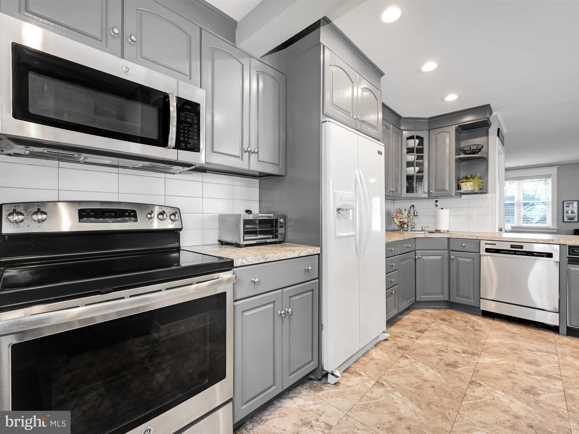 114 Summit Road Media, PA 19063 - Photo 12 of 27 a kitchen with cabinets stainless steel appliances and sink