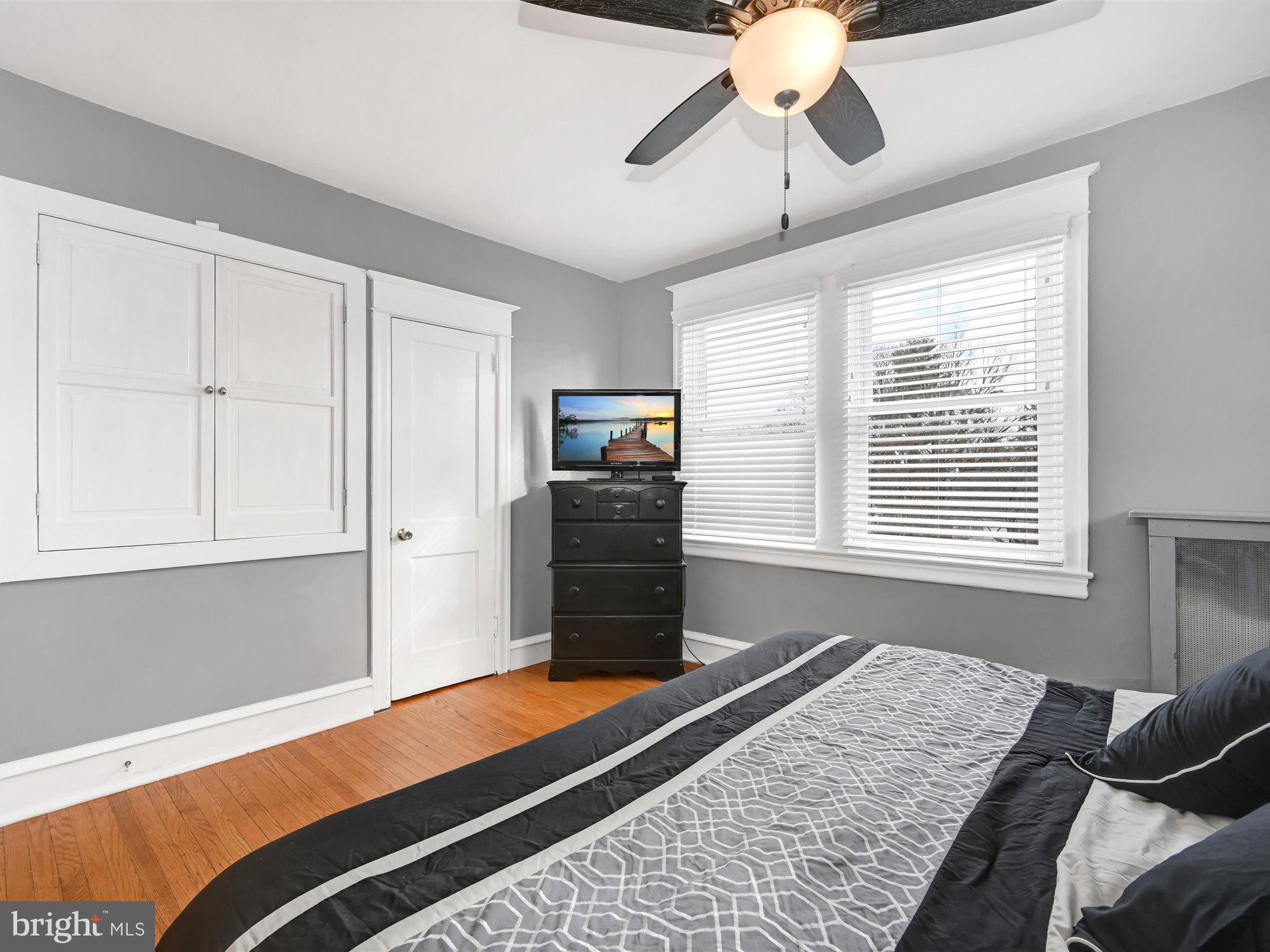 114 Summit Road Media, PA 19063 - Photo 15 of 27 a bedroom with a bed and wooden floor
