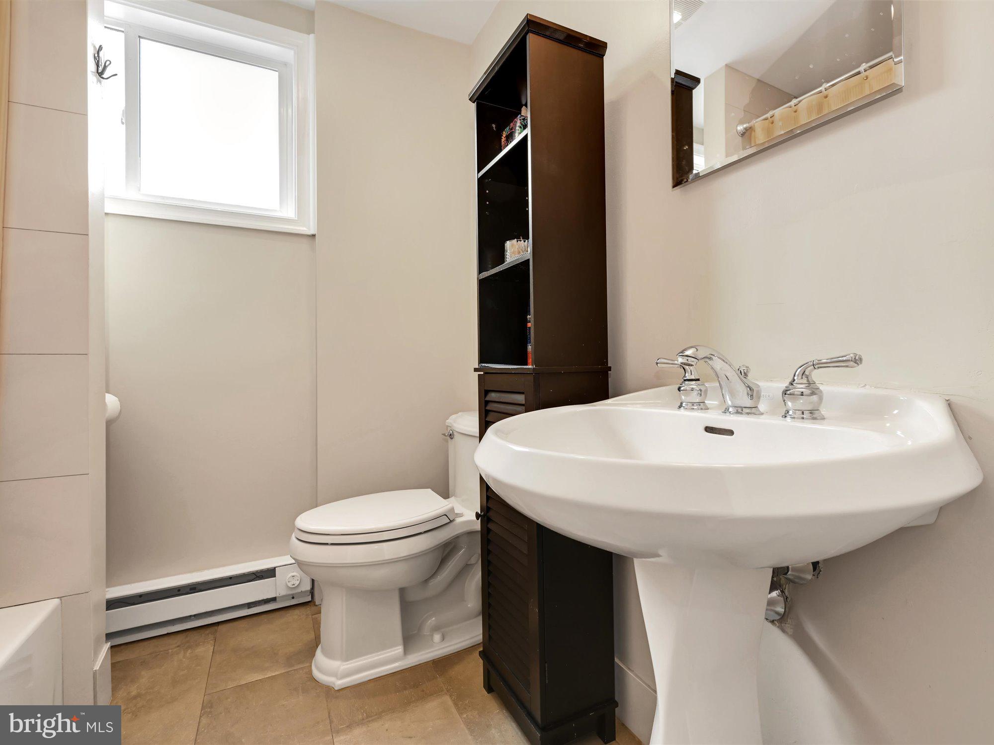 114 Summit Road Media, PA 19063 - Photo 18 of 27 a bathroom with a sink toilet and a mirror