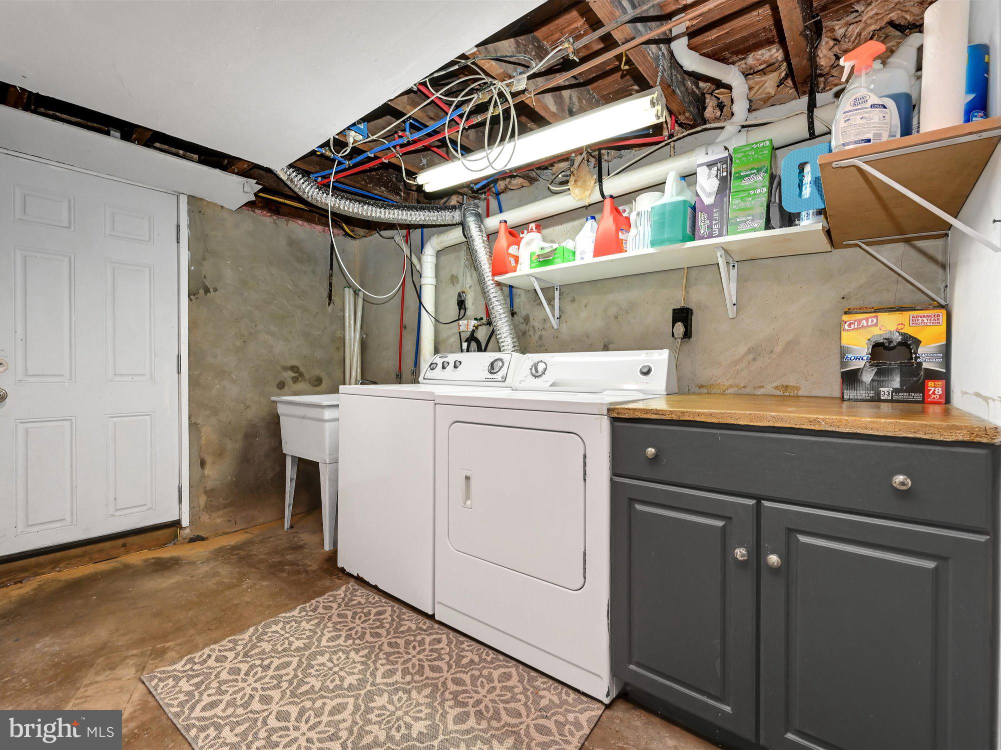 114 Summit Road Media, PA 19063 - Photo 20 of 27 a utility room with a sink dryer and washer