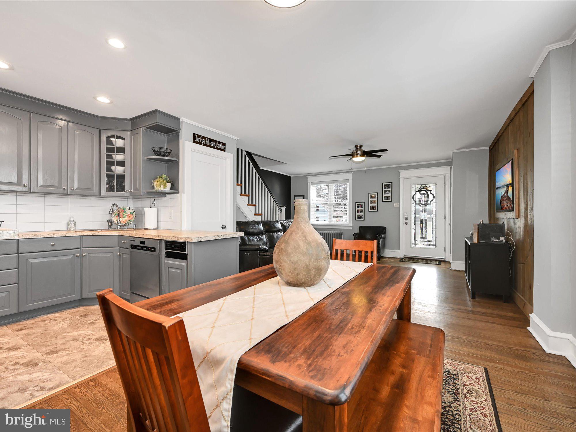 114 Summit Road Media, PA 19063 - Photo 9 of 27 a open kitchen with stainless steel appliances granite countertop a dishwasher kitchen island a table and chairs in it