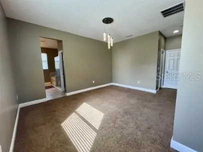 a view of an empty room and window