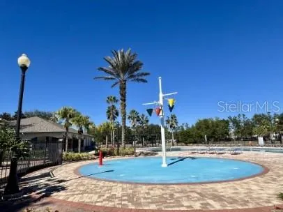 a view of a playground with a house
