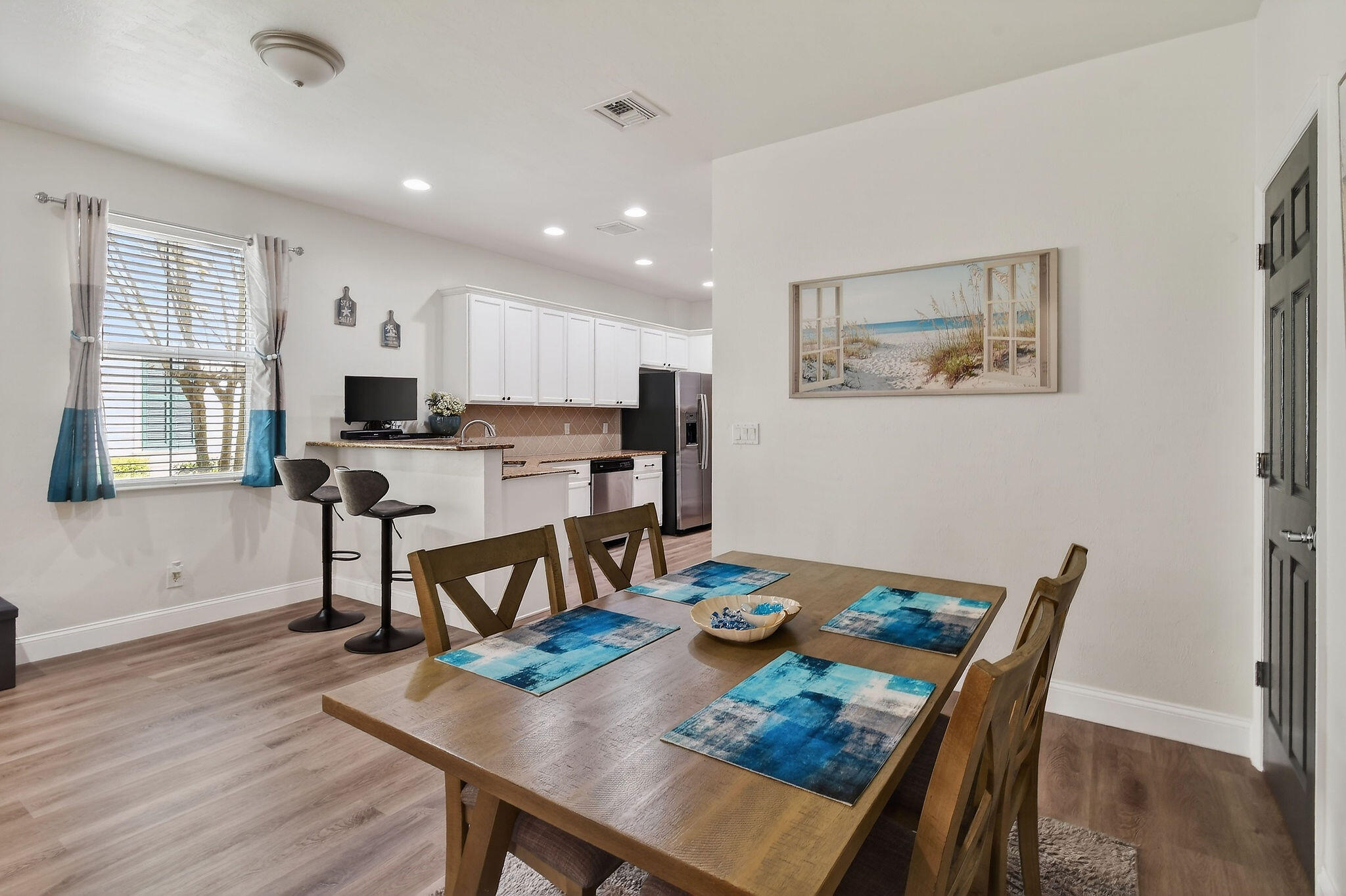 3241 Hemingway Drive Jupiter, FL 33458 - Photo 11 of 39 a view of a dining room with furniture window and wooden floor