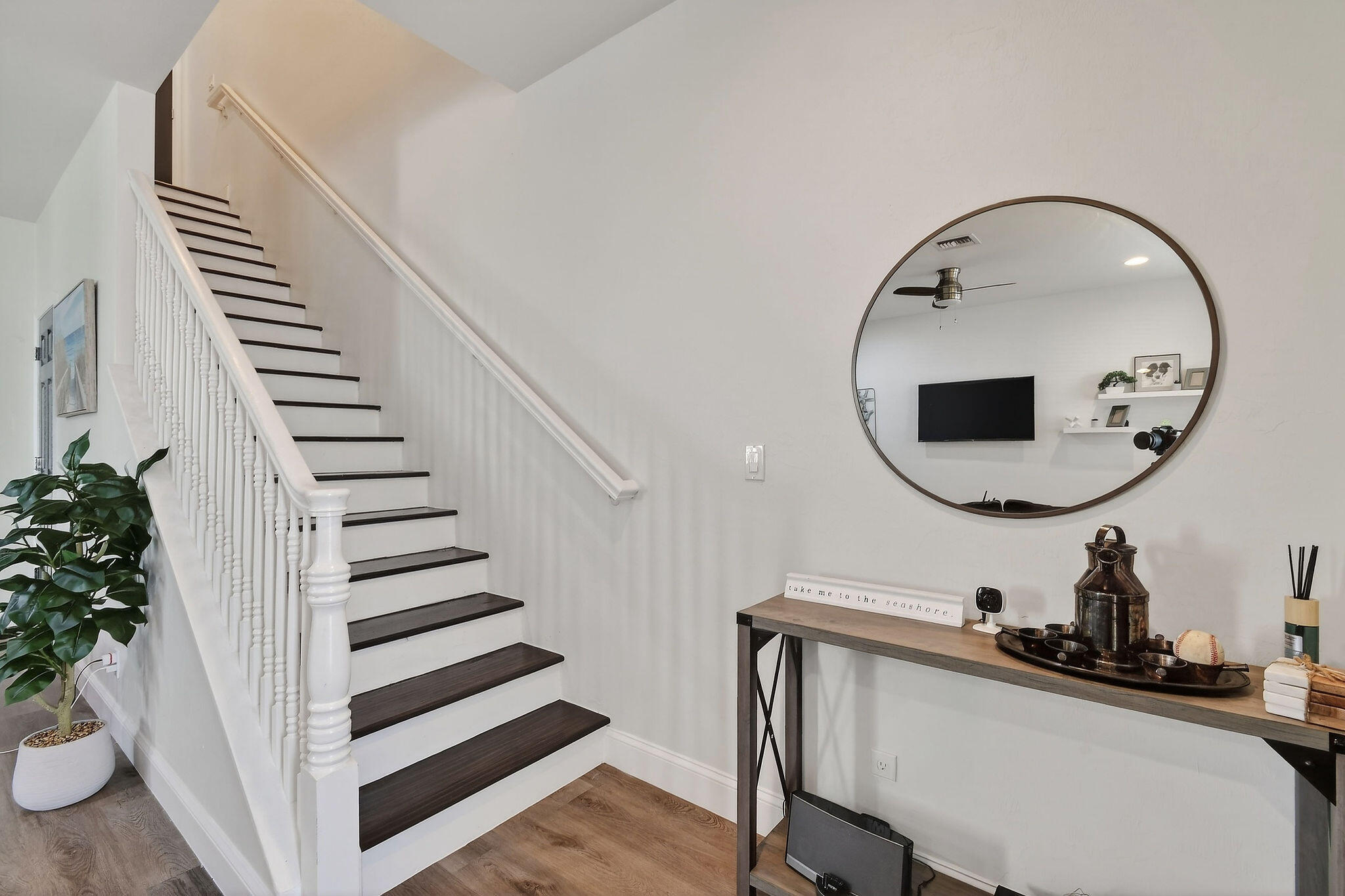 3241 Hemingway Drive Jupiter, FL 33458 - Photo 17 of 39 a view of a hallway with a potted plant and couches
