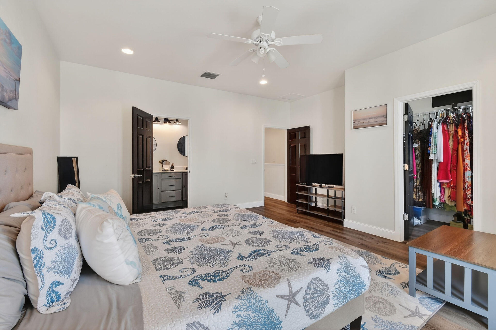 3241 Hemingway Drive Jupiter, FL 33458 - Photo 22 of 39 a bedroom with a bed and a large mirror on the dresser