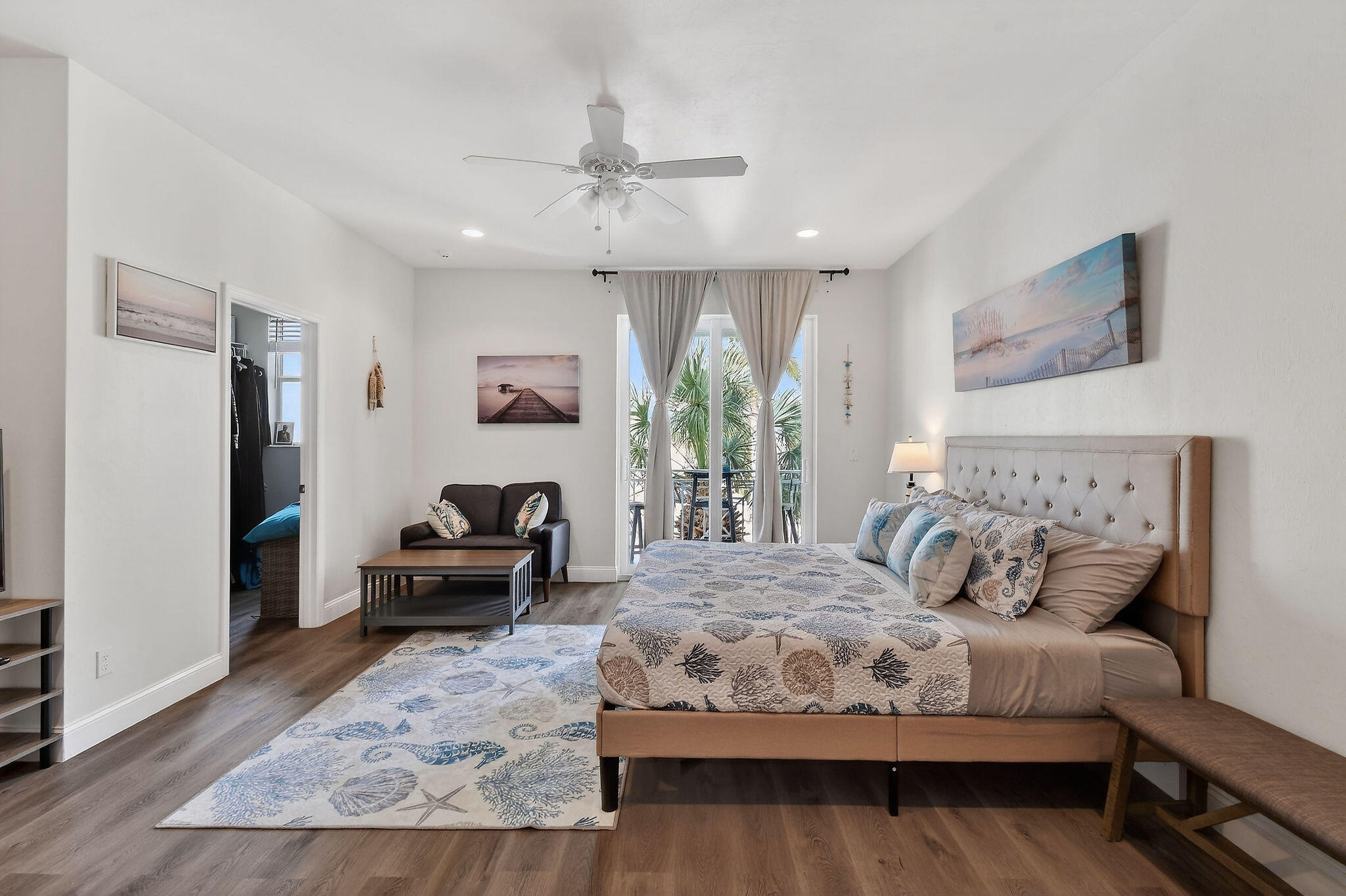 3241 Hemingway Drive Jupiter, FL 33458 - Photo 23 of 39 a bedroom with a bed wooden floor and furniture