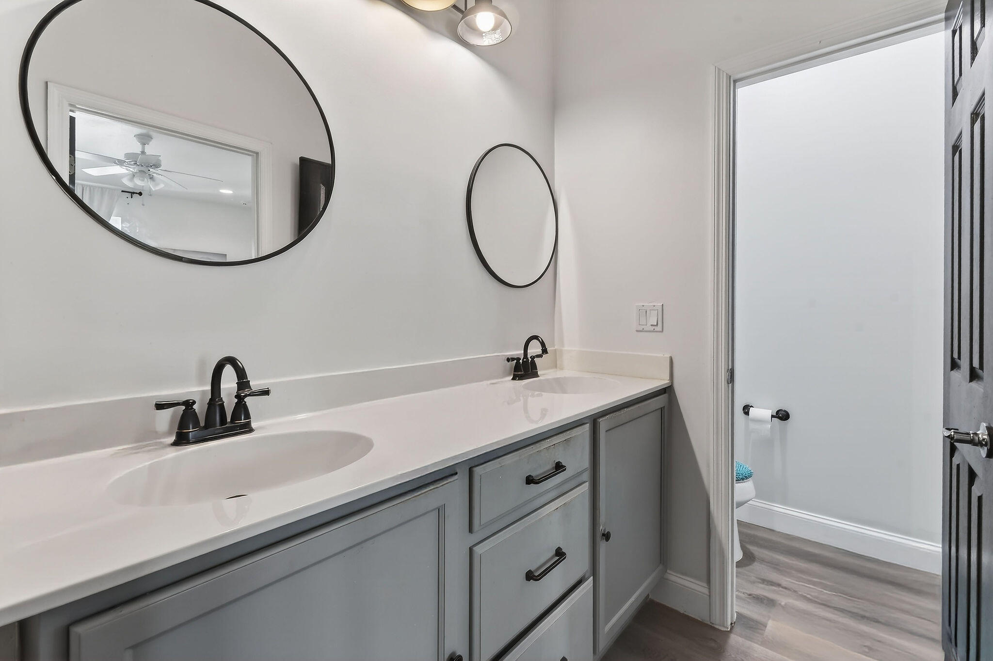 3241 Hemingway Drive Jupiter, FL 33458 - Photo 25 of 39 a bathroom with a double vanity sink and a mirror