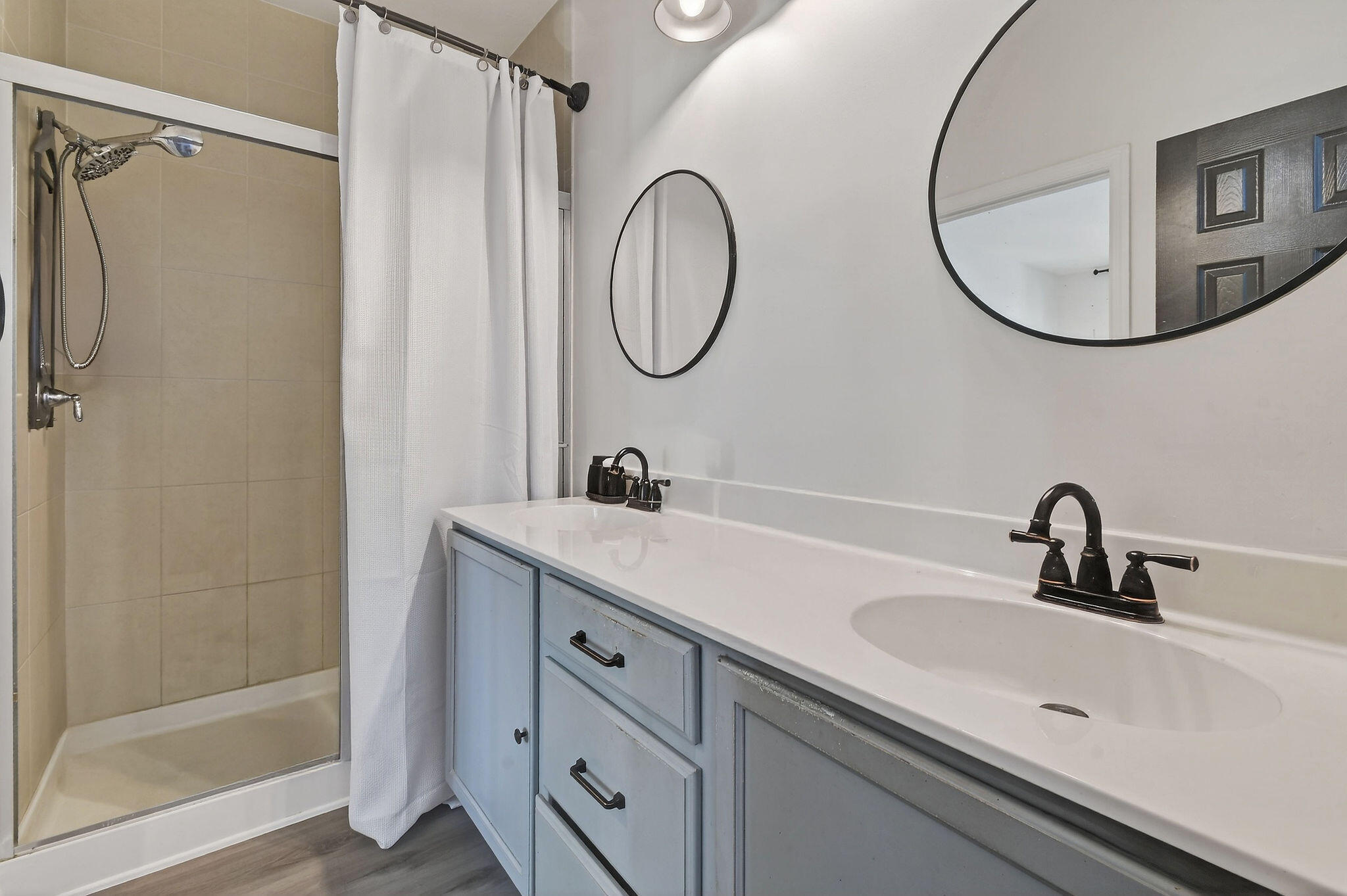 3241 Hemingway Drive Jupiter, FL 33458 - Photo 26 of 39 a bathroom with a double vanity sink mirror and shower