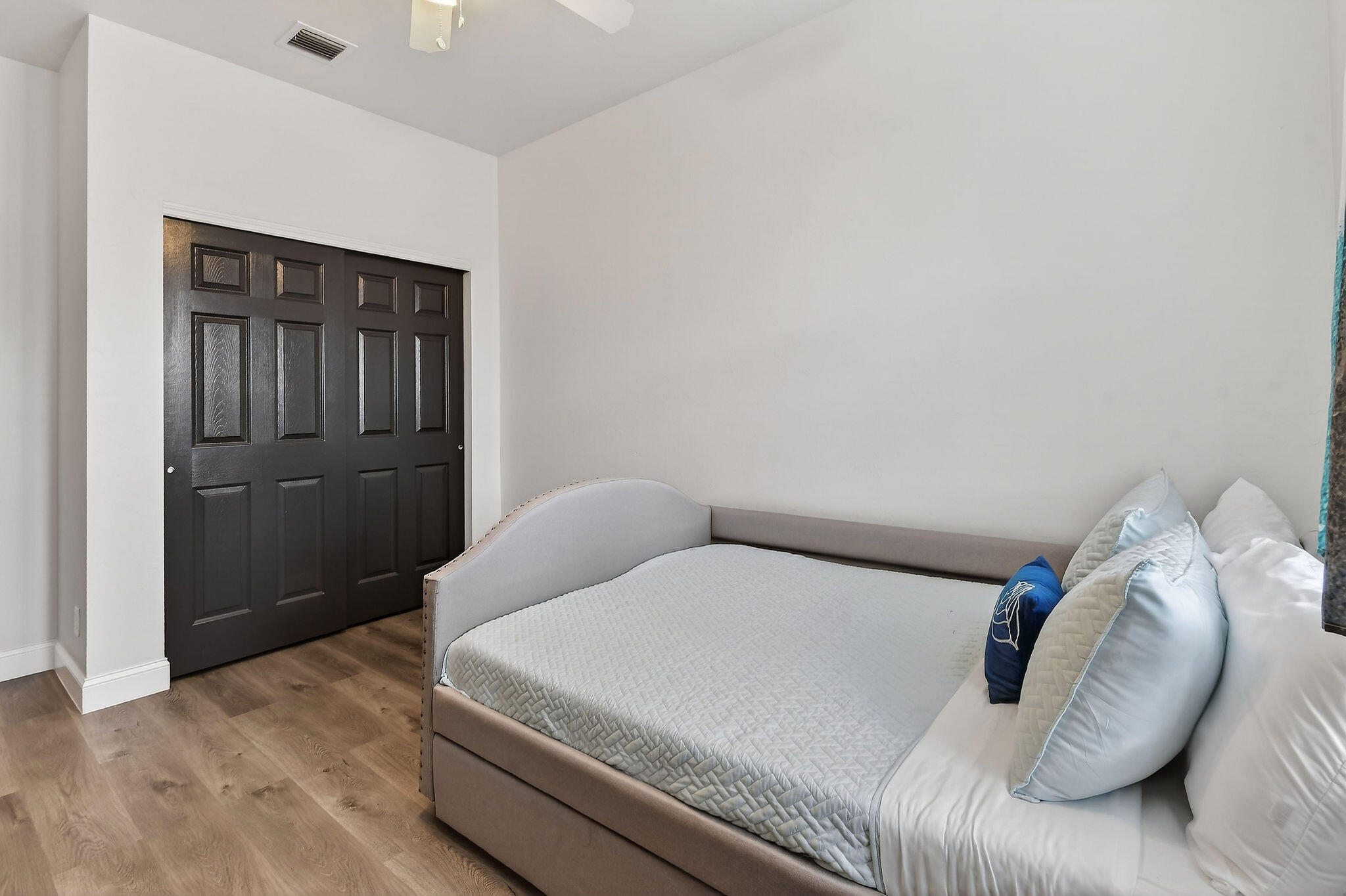 3241 Hemingway Drive Jupiter, FL 33458 - Photo 30 of 39 a bedroom with a bed and a cabinets