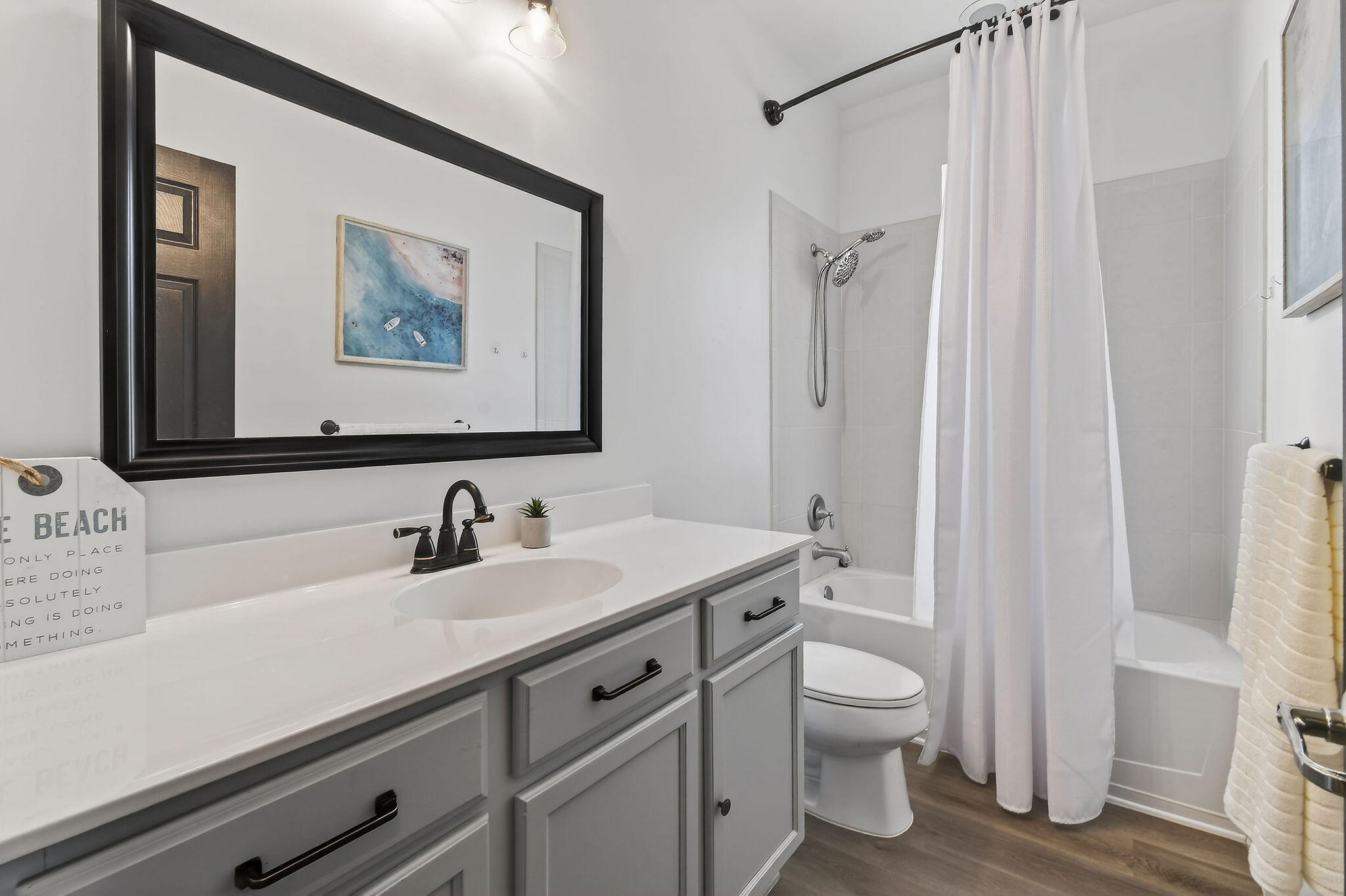 3241 Hemingway Drive Jupiter, FL 33458 - Photo 32 of 39 a bathroom with a toilet sink and mirror