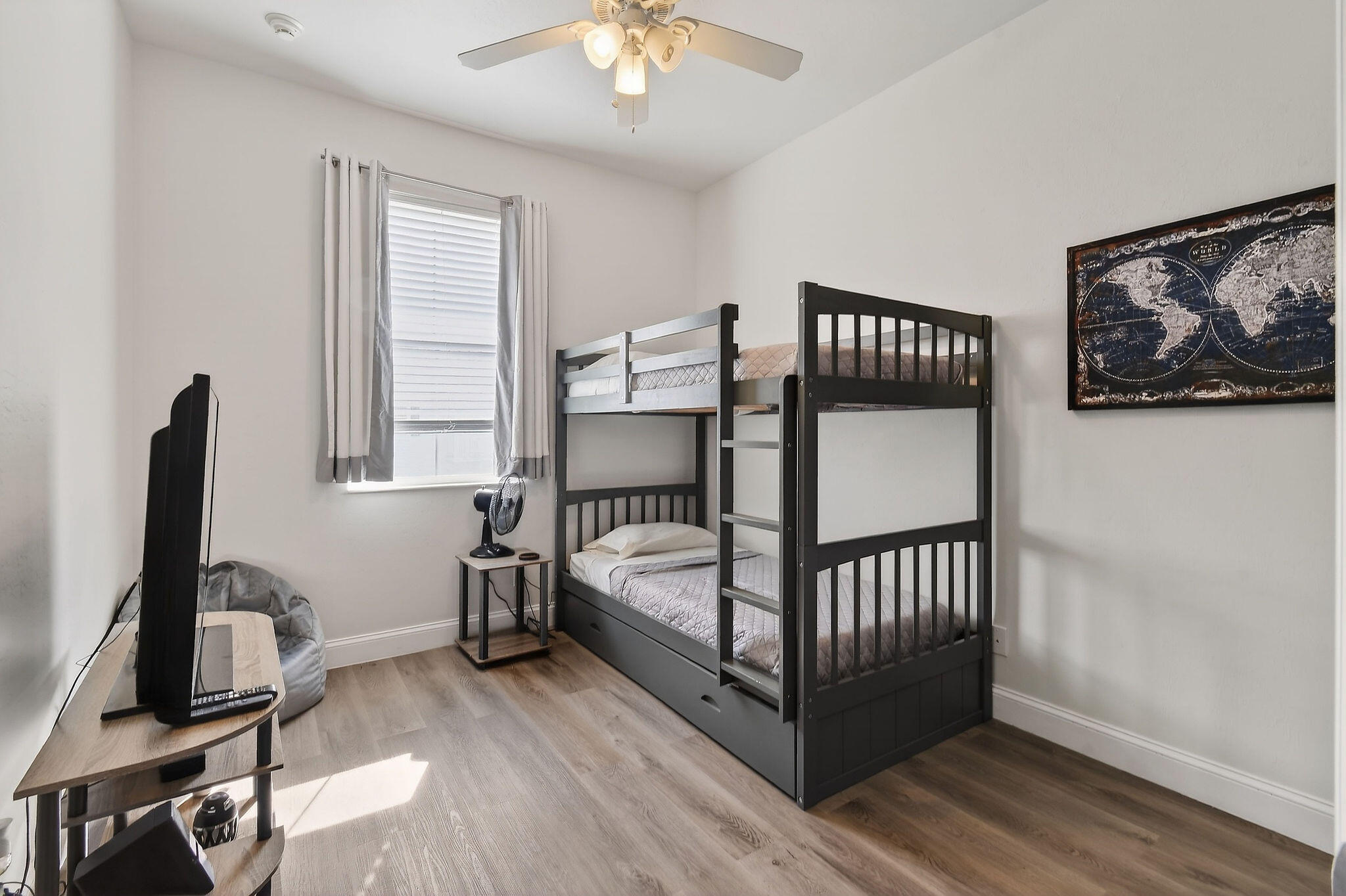 3241 Hemingway Drive Jupiter, FL 33458 - Photo 33 of 39 a bedroom with a bed and wooden floor