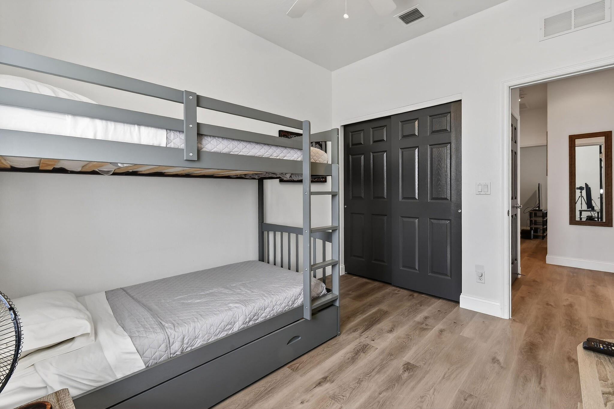 3241 Hemingway Drive Jupiter, FL 33458 - Photo 35 of 39 a bedroom with a bed and wooden floor