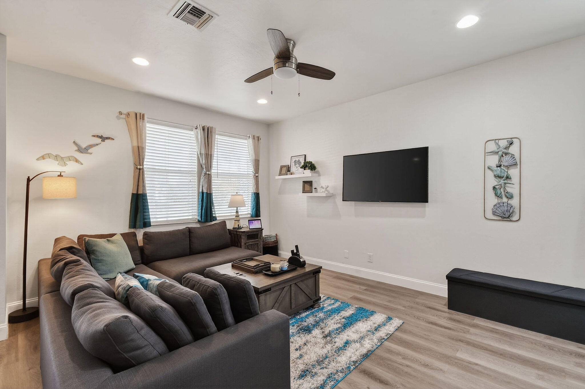 3241 Hemingway Drive Jupiter, FL 33458 - Photo 6 of 39 a living room with furniture and a flat screen tv