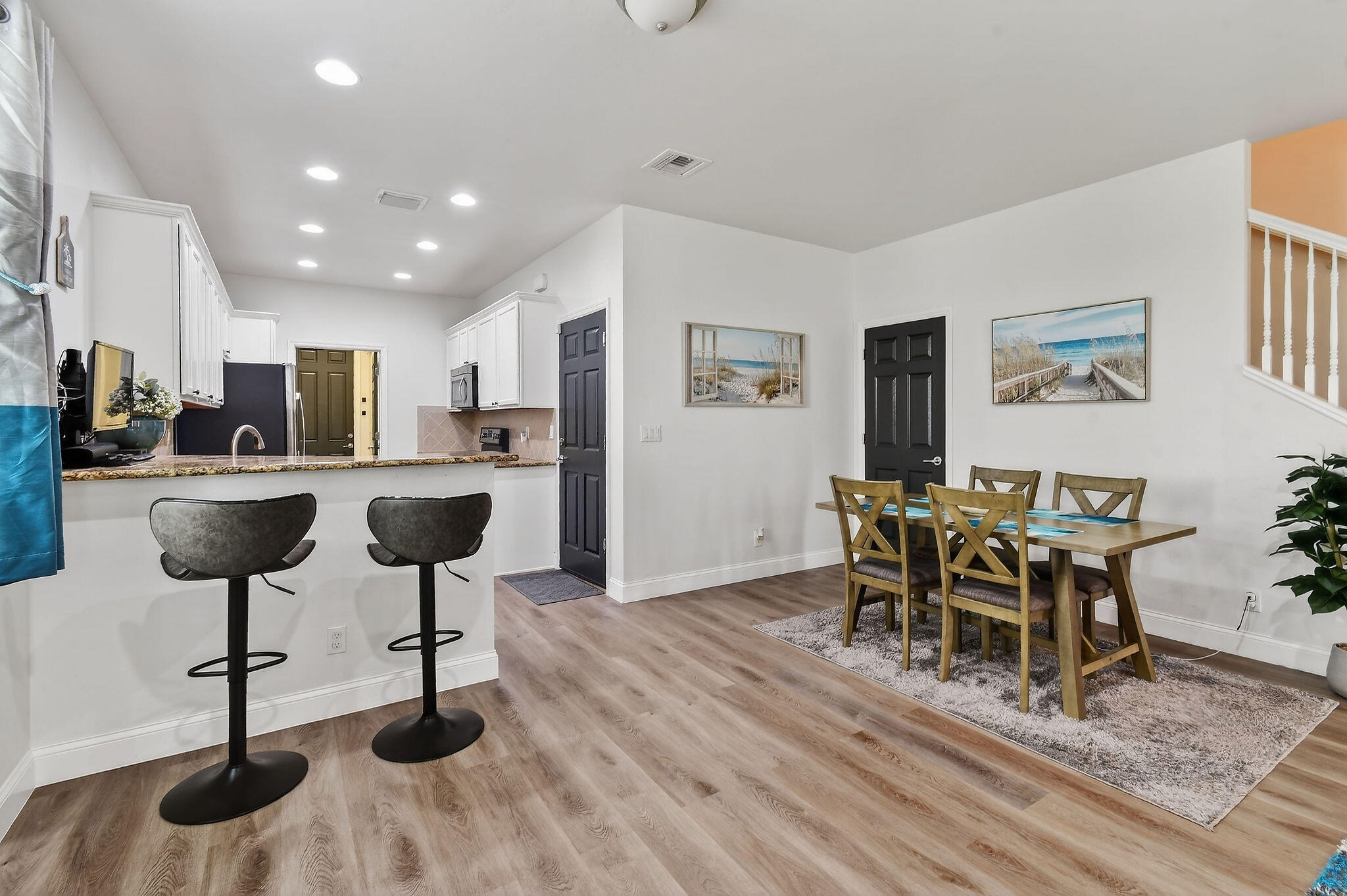 3241 Hemingway Drive Jupiter, FL 33458 - Photo 9 of 39 a living room with furniture and a chandelier