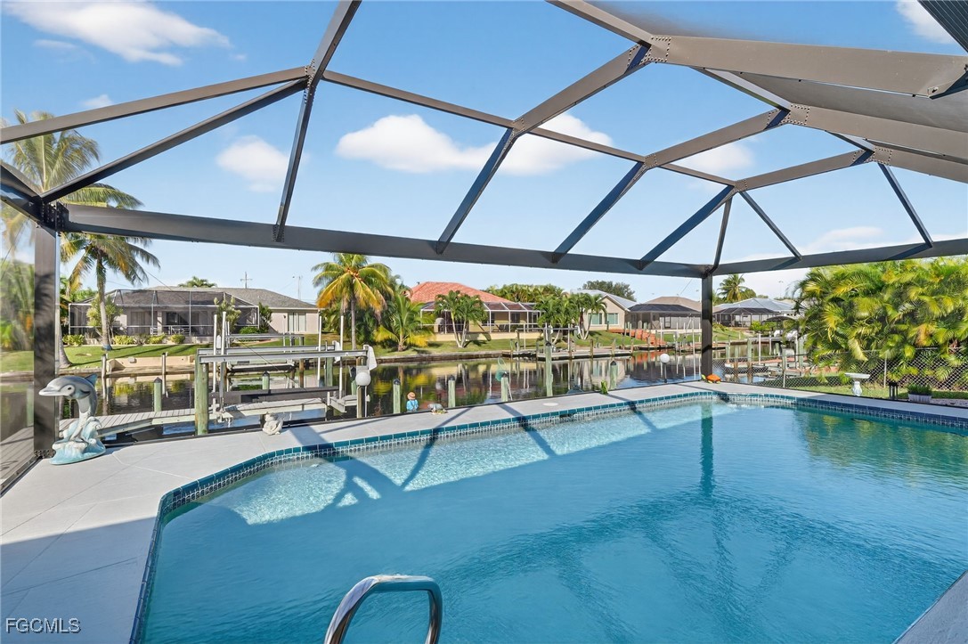 4306 Southwest 3rd Avenue Cape Coral, FL 33914 - Photo 29 of 50 a view of a swimming pool with a patio