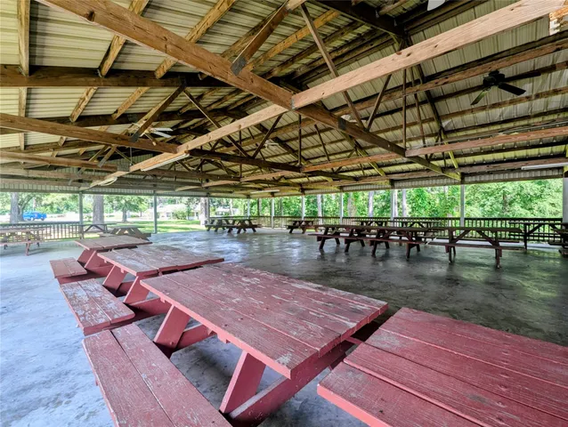 an aerial view of a house with a yard and lake view