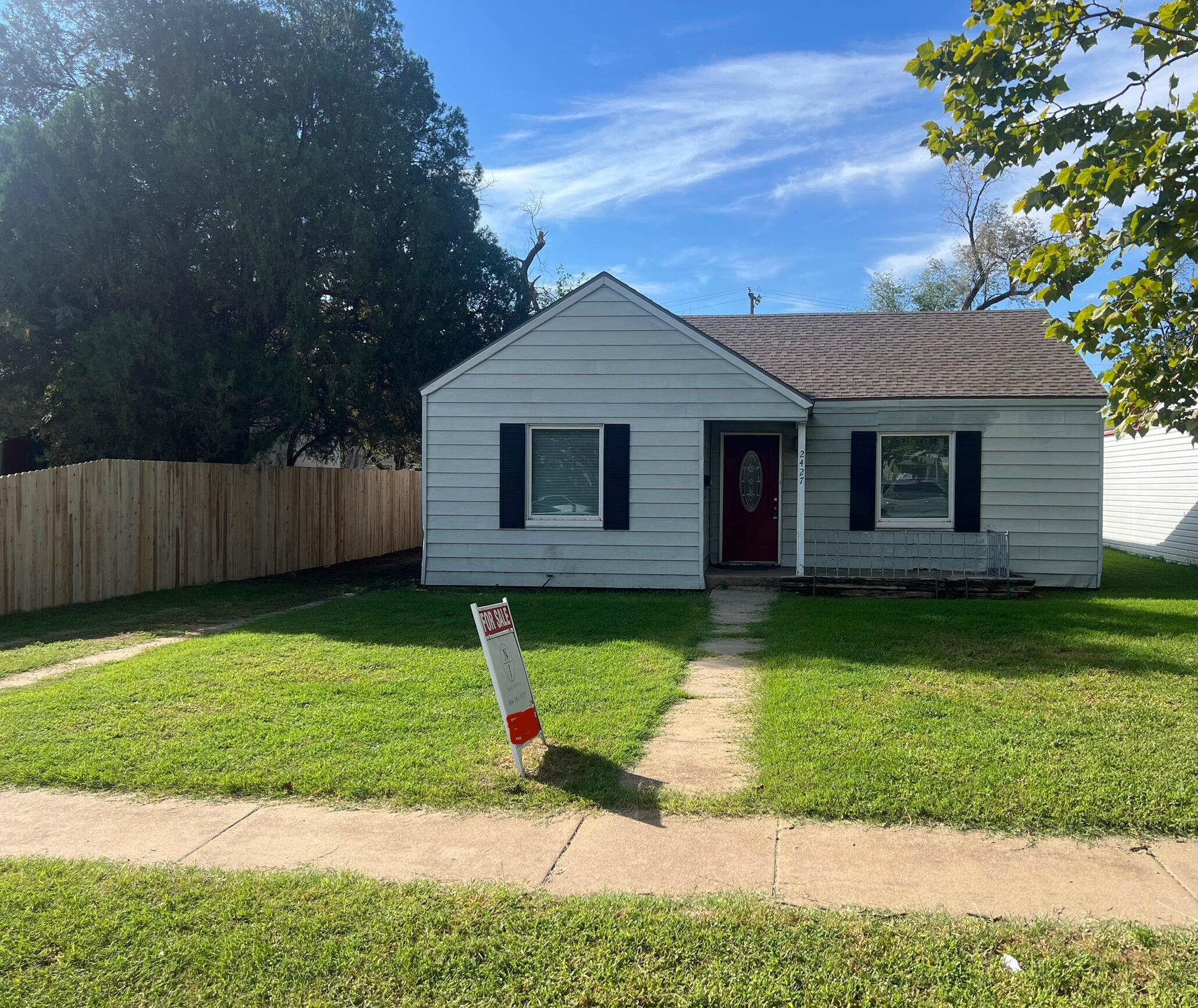 2427 26th Street Lubbock, TX 79411 - Photo 1 of 28 a front view of a house with a yard