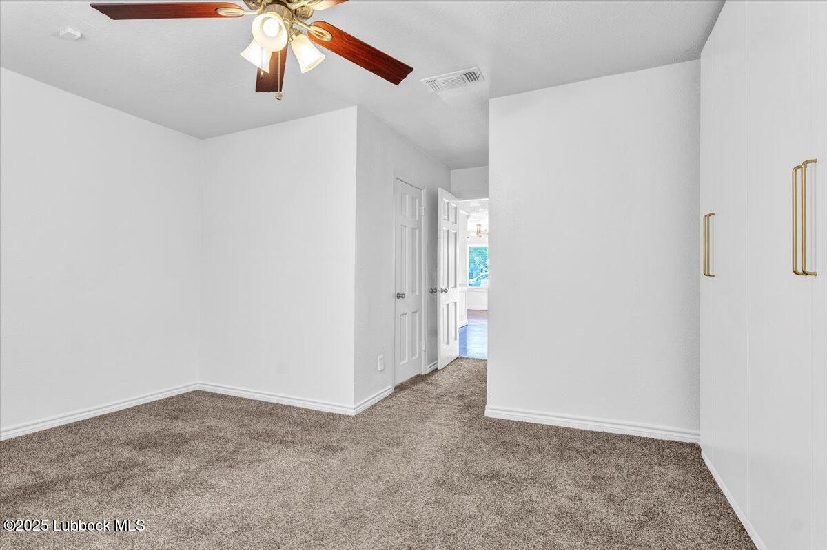2427 26th Street Lubbock, TX 79411 - Photo 15 of 28 a view of a hallway with closet