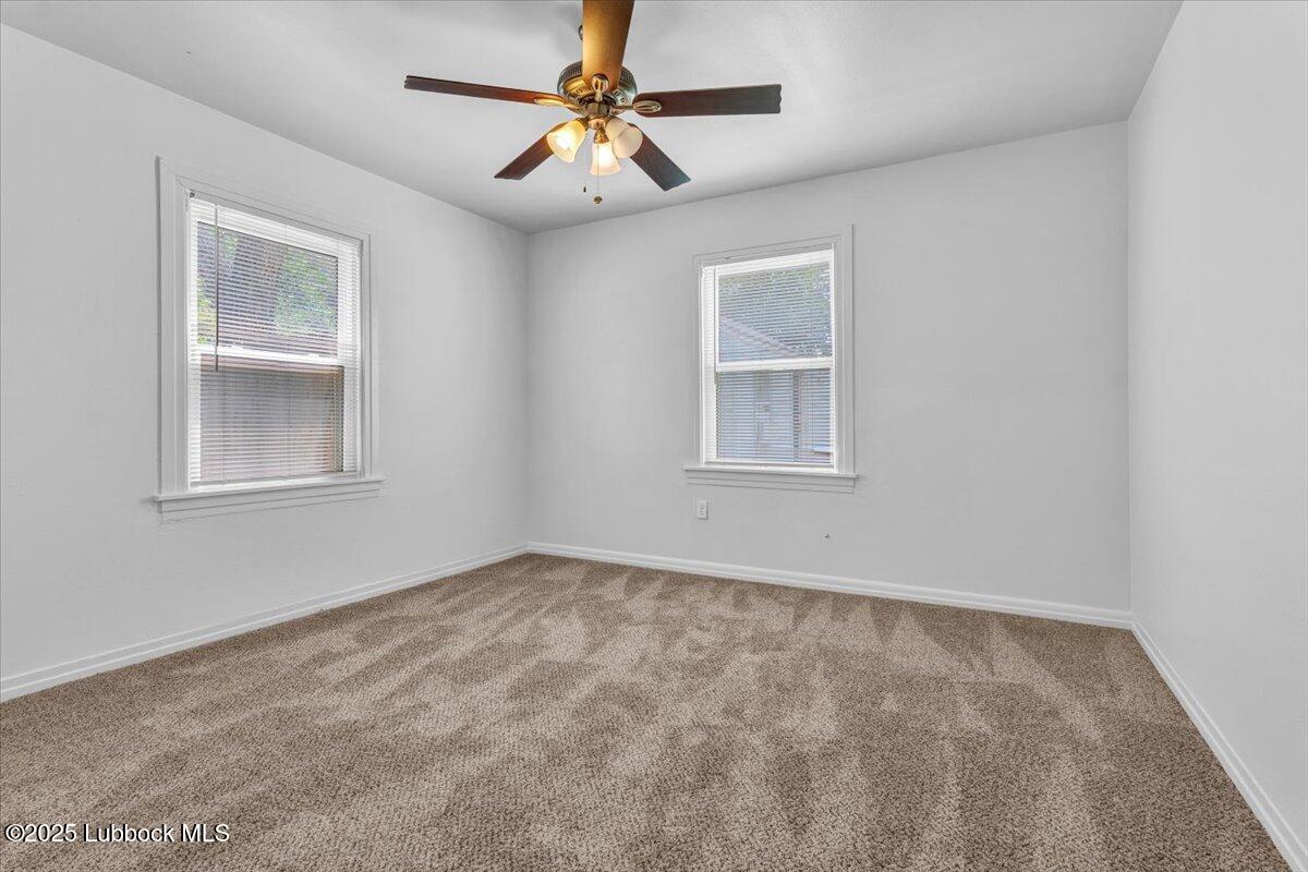 2427 26th Street Lubbock, TX 79411 - Photo 19 of 28 a view of an empty room with a window