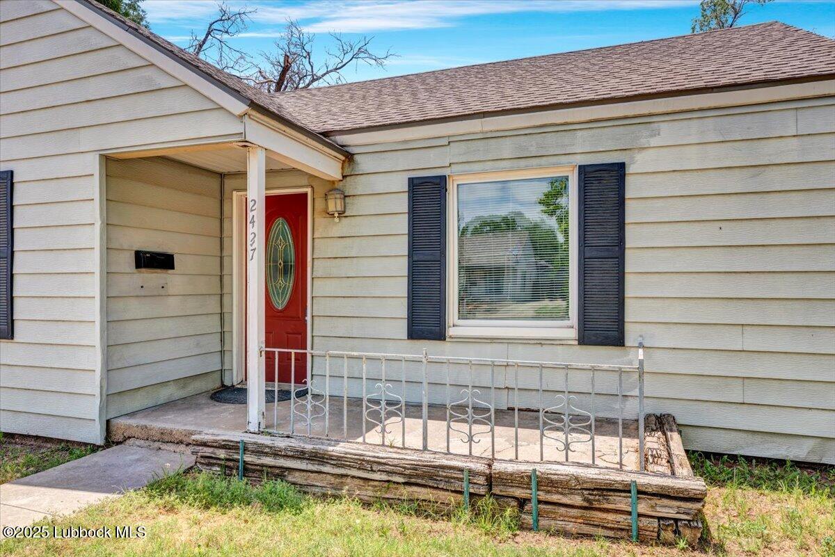 2427 26th Street Lubbock, TX 79411 - Photo 3 of 28 a front view of a house with a yard