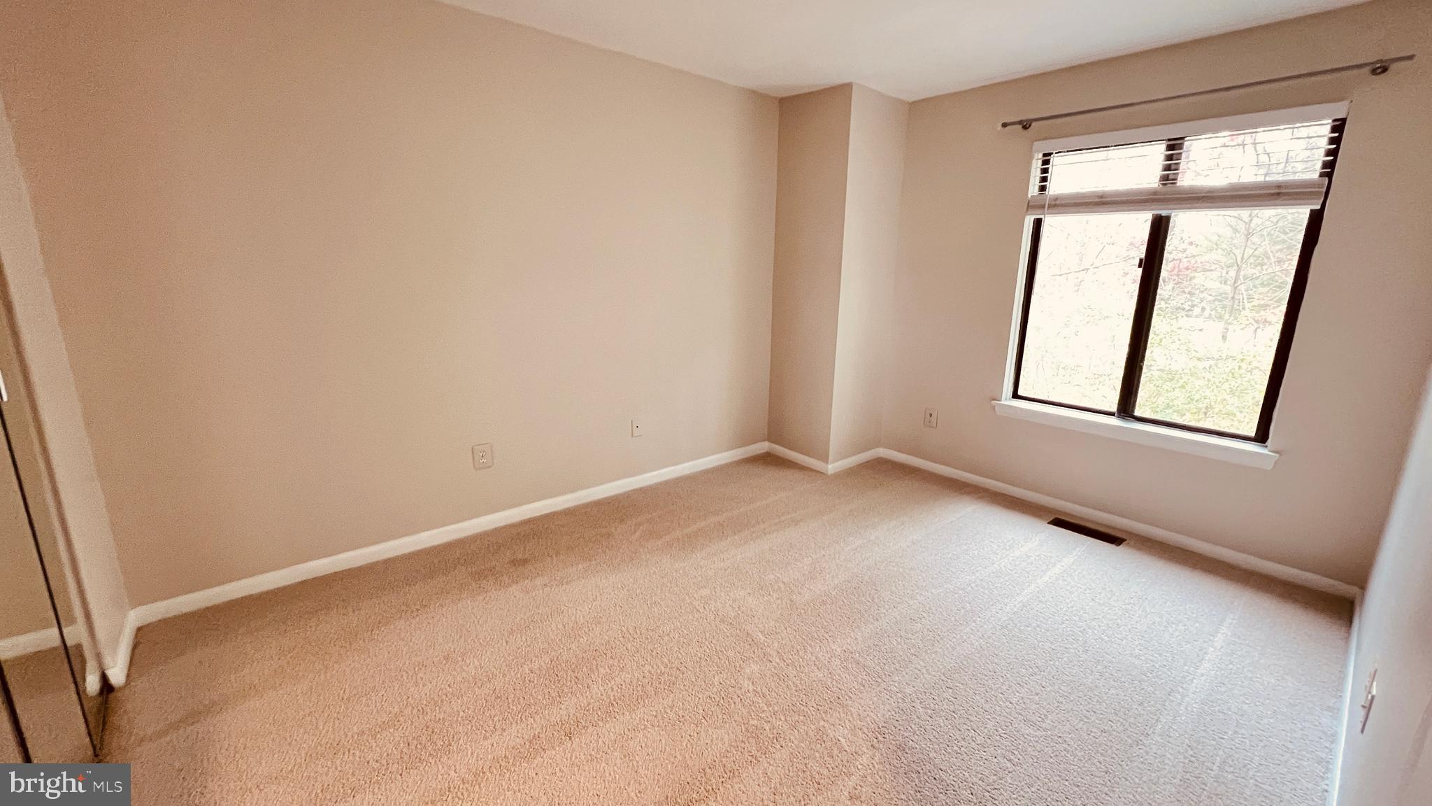 7853 Muirfield Court Potomac, MD 20854 - Photo 13 of 25 an empty room with windows