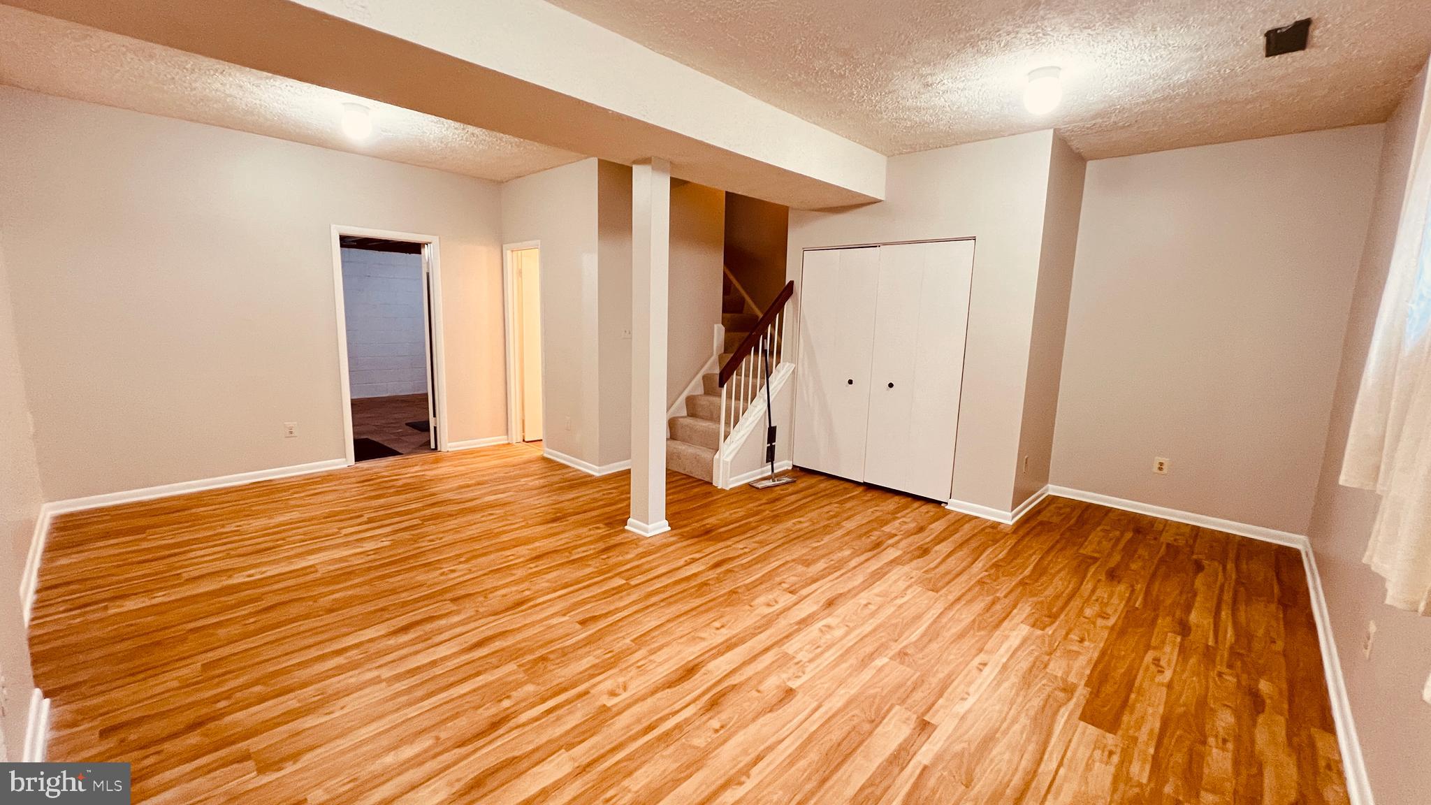 7853 Muirfield Court Potomac, MD 20854 - Photo 17 of 25 a view of empty room with wooden floor