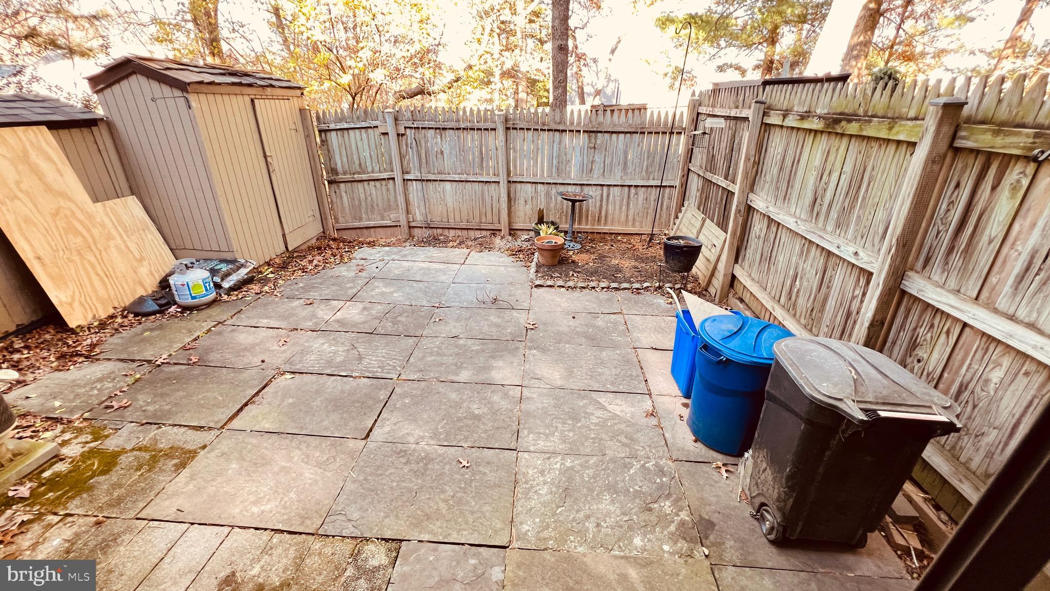 7853 Muirfield Court Potomac, MD 20854 - Photo 23 of 25 a view of a backyard with sitting area