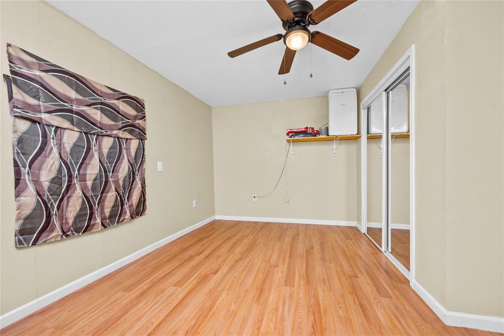 447 Masthead Road Gun Barrel City, TX 75156 - Photo 15 of 27 a view of a room with wooden floor and ceiling fan