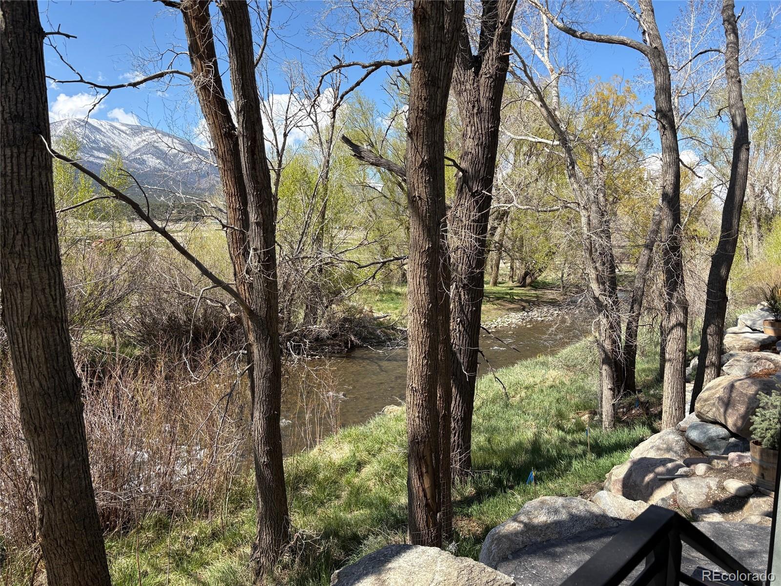 205 Two Rivers Road, Unit G Salida, CO 81201 - Photo 11 of 22 a view of backyard with plants and outdoor seating