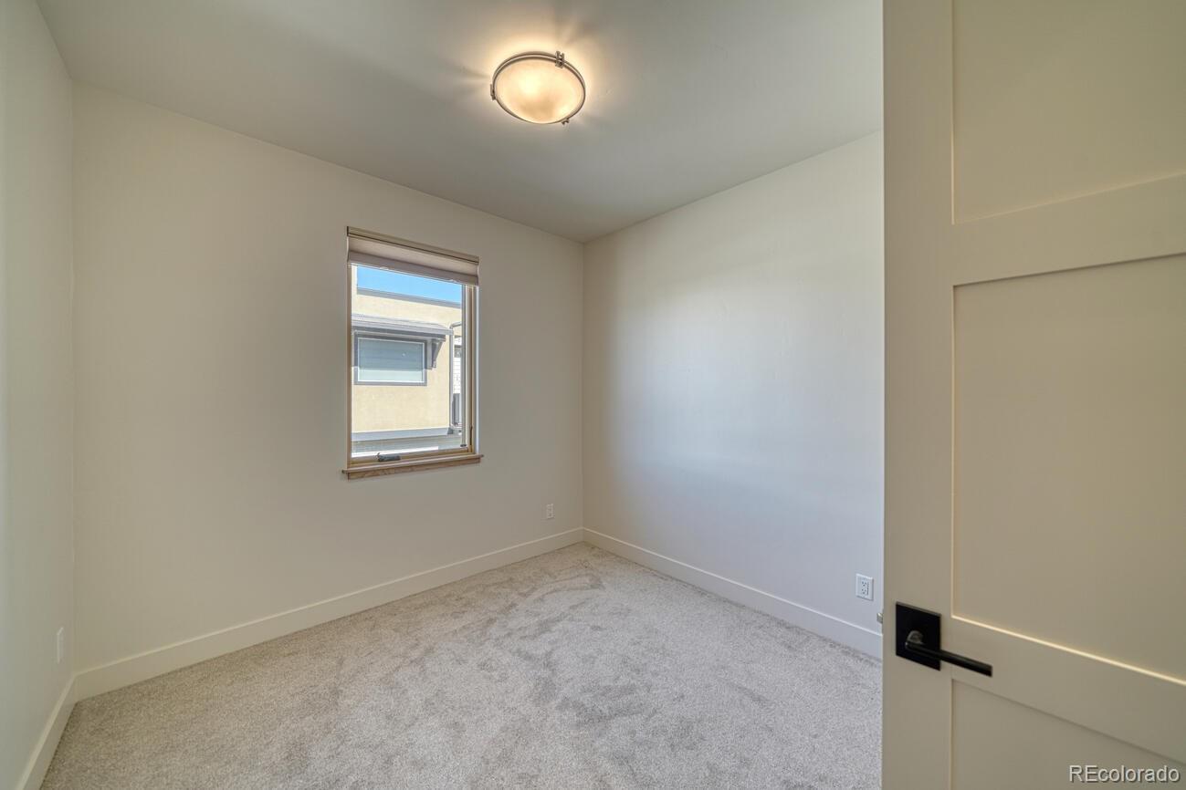 205 Two Rivers Road, Unit G Salida, CO 81201 - Photo 18 of 22 an empty room with a window