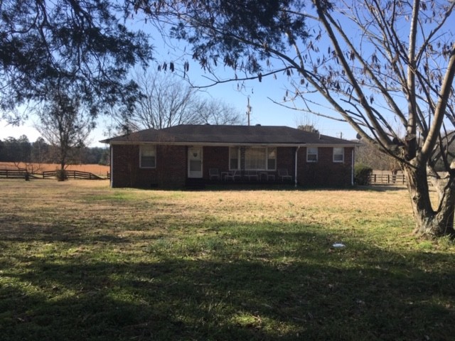 4657 Murfreesboro Road Franklin, TN 37067 - Photo 1 of 13 a view of house with yard in front of it