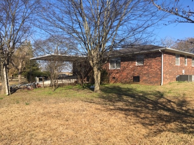 4657 Murfreesboro Road Franklin, TN 37067 - Photo 9 of 13 a view of a yard with a tree