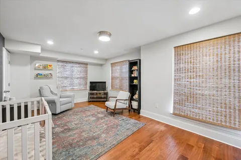 a living room with furniture and a rug