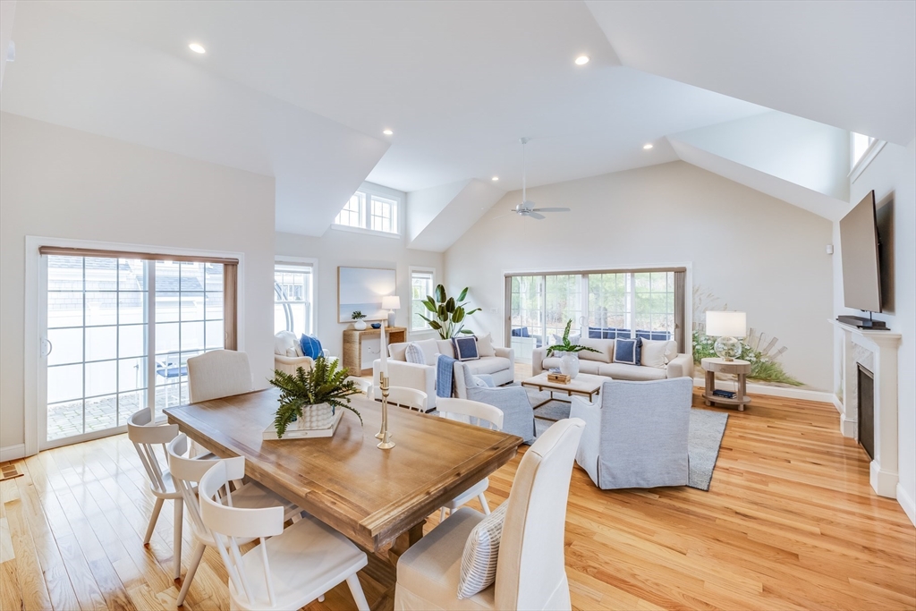 56 Cottage Lane Mashpee, MA 02649 - Photo 13 of 42 a view of a dining room with furniture window and wooden floor