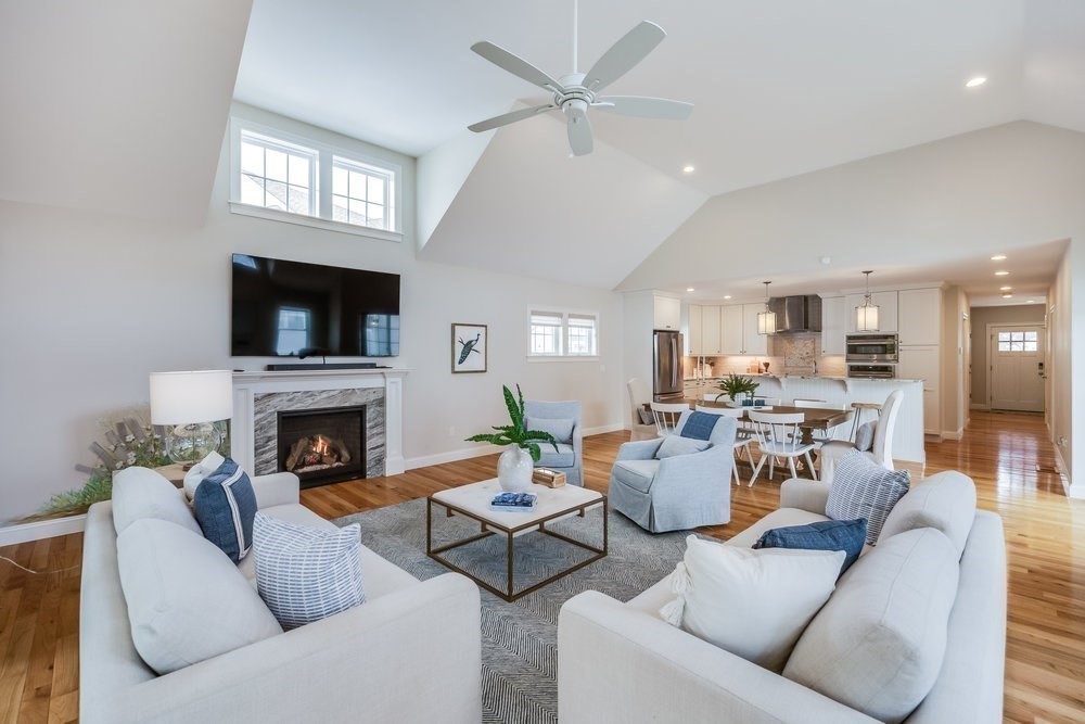 56 Cottage Lane Mashpee, MA 02649 - Photo 14 of 42 a living room with furniture a fireplace and a flat screen tv