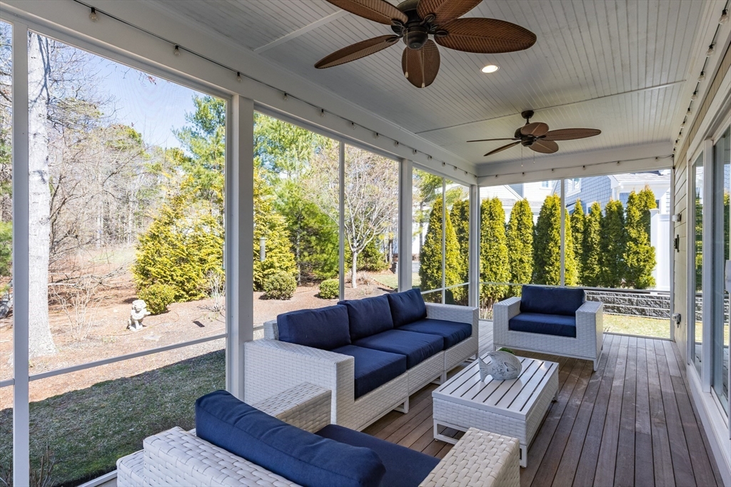 56 Cottage Lane Mashpee, MA 02649 - Photo 19 of 42 a living room with wooden floor and a large window