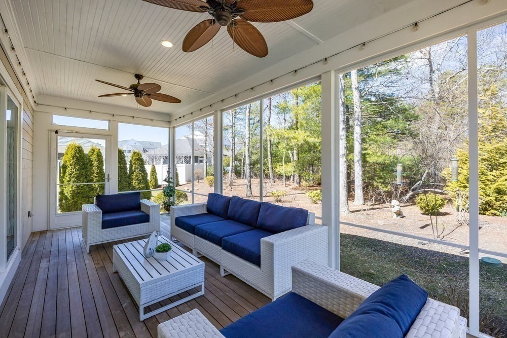 56 Cottage Lane Mashpee, MA 02649 - Photo 20 of 42 a living room with furniture and a large window